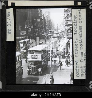 Oxford Street, City of Westminster, Greater London Authority, 1931. An elevated view looking west along a congested Oxford Street from the junction with Tottenham Court Road. The caption on this slide reads: &quot;Oxford Street, looking west from Tottenham Court Road, 1931&quot;. Stock Photo