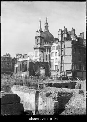 St Paul's Cathedral, St Paul's Churchyard, City of London, City and County of the City of London, Greater London Authority, 1941-1945. A view looking south-west across a bomb damaged landscape towards the Church of St Verdast-alias-Foster with St Paul's Cathedral beyond. The Church of St Verdast-alias-Foster was rebuilt by Christopher Wren after the Great Fire of London in 1666. In the Second World War it was gutted by fire during the Blitz in 1940-41 and was later rebuilt after the war with work starting in 1953. St Paul's Cathedral survived the bombing raids but other buildings in the area w Stock Photo