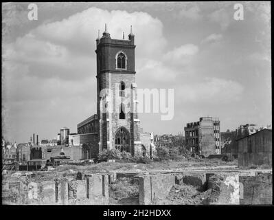 St Giles' Cripplegate, Fore Street, City and County of the City of London, Greater London Authority, 1941-1945. A view looking south-east across a bomb damaged landscape towards St Giles' Cripplegate Church. St Giles' Church was badly damaged during the Blitz in 1941 and the immediate area around it was almost completely destroyed by bombing. The church was rebuilt in the 1950s and now stands at the centre of the Barbican Estate. Stock Photo