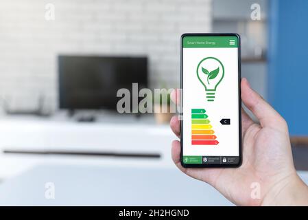 Energy efficiency mobile app on screen. Ecology, eco house concept Stock Photo