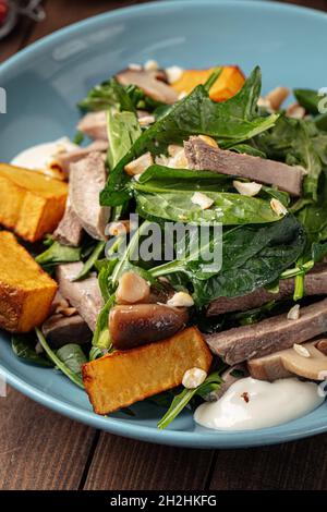 Bowl of healthy beef salad with potato and spinach Stock Photo