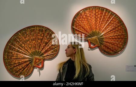 Sotheby’s, London, UK. 22 October 2021. Over 1,000 years of historic objects, paintings & manuscripts at Sotheby’s Arts of the Islamic World sale preview. Image: Two fans (pankha), India, Madras, 19th/20th century. Estimate: £4,000-6,000. Credit: Malcolm Park/Alamy Live  News Stock Photo