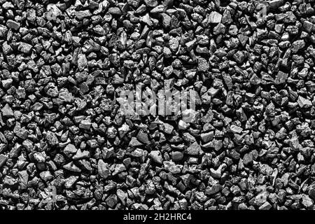 Close-up of black activated carbon texture. Coconut charcoal. Stock Photo
