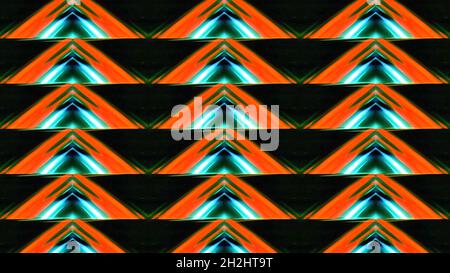 Triangular pattern with luminous lines. Motion. Kaleidoscopic pattern of triangles shimmering with neon colors. Repeating pattern of triangles and lin Stock Photo