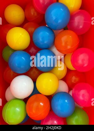 Close up of colorful plastic balls in kids playroom Stock Photo