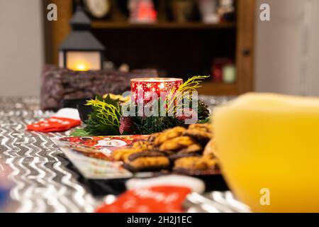 Beautiful table setting with Christmas decorations in living room. Stock Photo