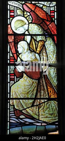 A stained glass window depicting the second coming; A woman is helped towards jesus by an angel, St Peter's Church, Dunchurch, Warwickshire Stock Photo