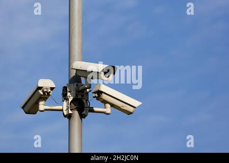 Three cameras were installed on the pole to observe the area in order to ensure the safety of residents. Stock Photo