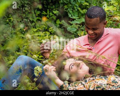 Lovely mixed race couple in a forest Stock Photo