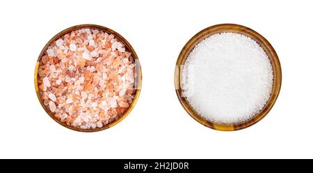 Top view of pink himalayan salt seasoning in round brown wooden bowl set isolated on white background. Stock Photo