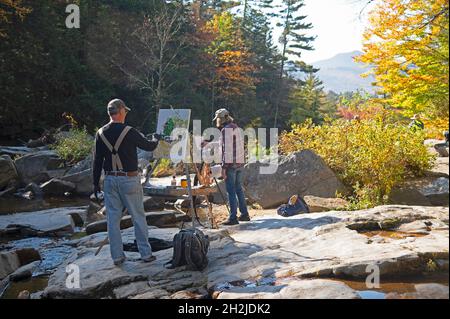 A pair of artists at work in the Jackson Falls - Jackson, New Hampshire, USA Stock Photo