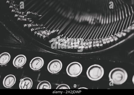 Letters and numbers on the keys of an old typewriter for typing Stock Photo