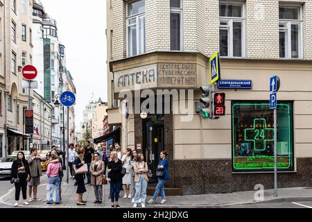 Moscow, Russia - August 21, 2021: people on corner of Malaya Bronnaya Street and Spiridonievsky Lane in center of Moscow city in summer overcast eveni Stock Photo