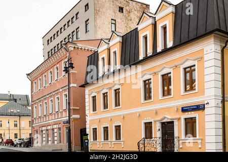 Moscow, Russia - August 29, 2021: old houses 23, 25 on Rozhdestvenka street in Moscow city at sunset. The tenement houses were built at the end of the Stock Photo