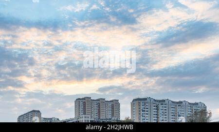 blue sunset sky over modern high-rise apartment building in Moscow city in evening
