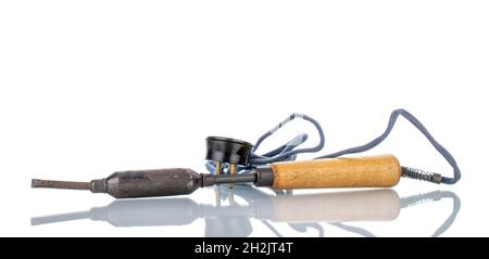 One old metal soldering iron, close-up, isolated on white. Stock Photo