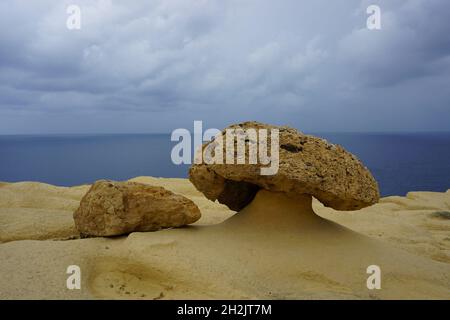 weathered limestone in mushroom shape on beach on Gozo Island, Malta. Photo by Willy Matheisl Stock Photo