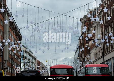 London, UK.  22 October 2021.  Christmas decorations are suspended overhead ahead of the Oxford Street Christmas Lights switch on in the next few weeks.  Retailers are hoping that shoppers will be back in large numbers and not be deterred by possible shortages of product and inflationary pressures.  Credit: Stephen Chung / Ģ����ý Live News Stock Photo