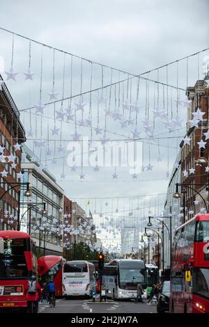 London, UK.  22 October 2021.  Christmas decorations are suspended overhead ahead of the Oxford Street Christmas Lights switch on in the next few weeks.  Retailers are hoping that shoppers will be back in large numbers and not be deterred by possible shortages of product and inflationary pressures.  Credit: Stephen Chung / Ģ����ý Live News Stock Photo