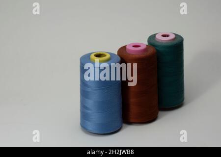 Two cotton thread spools on white Stock Photo