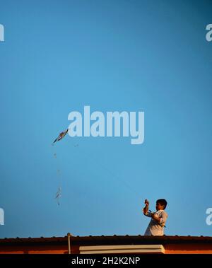 A boy is flying kite Stock Photo