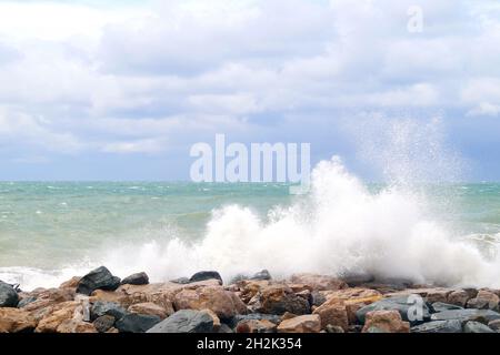 High waves beat against the rocks on the Black Sea Stock Photo