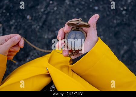 Close-up of a woman's hands holding a compass Stock Photo