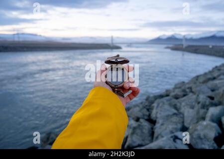 Close-up of a woman's hands holding a compass Stock Photo