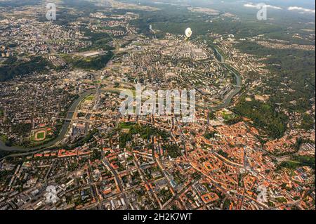 Vilnius, Lithuania - September 14, 2021: White hot air balloon flying above Vilnius capital of Lithuania. Vilnius cityscape view from the sky Stock Photo