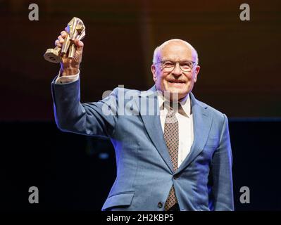 Hessen, Germany. 22nd Oct, 2021. 22 October 2021, Hessen, Offenbach/Main: Director Volker Schlöndorff is on stage at the award ceremony of the Hessian Film and Cinema Award 2021 with the honorary prize of the Hessian Minister President. Due to the Corona pandemic, the award ceremony will take place on a smaller scale with around 350 invited guests at the Capitol in Offenbach. Photo: Frank Rumpenhorst/dpa Credit: dpa picture alliance/Alamy Live News Stock Photo
