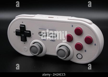 White gamepad isolated on black background Stock Photo