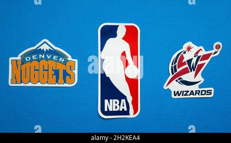 October 1, 2021, Springfield, USA, Emblems of the Denver Nuggets and Washington Wizards basketball teams on a blue background. Stock Photo