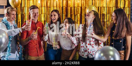New Year party. Group of young people having fun. Stock Photo