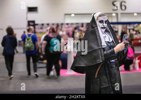 ExCel, London, UK. 22nd Oct, 2021. A participant in Horror Nun outfit. Cosplayers, fans and visitors once again descend on the ExCel London exhibition centre for MCM Comic Con. MCM London Comic Con returns 22-24 October for a celebration of Pop Culture. Credit: Imageplotter/Alamy Live News Stock Photo