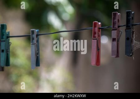 plastic clips to hang freshly washed clothes Stock Photo