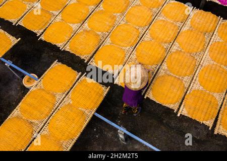 Workers are drying rice noodles in the sun Stock Photo - Alamy