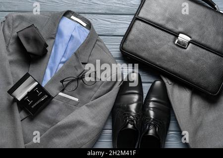 Set of stylish male accessories on dark wooden background Stock Photo