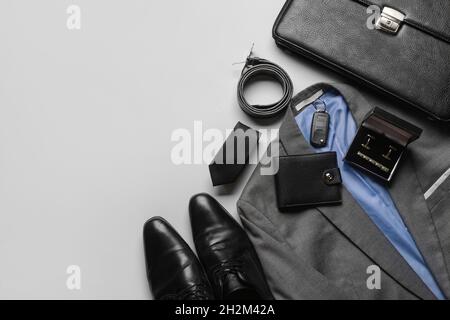 Set of stylish male accessories and clothes on grey background Stock Photo
