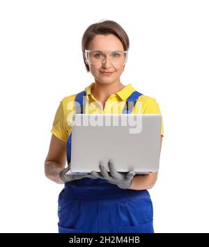 Female construction worker in safety goggles using laptop on white background Stock Photo
