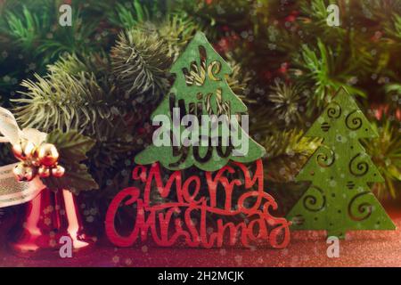 Christmas tree branches with snow and paper card note. Flat lay. Nature New Year concept. Stock Photo