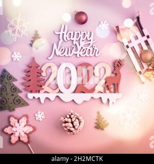 Christmas tree branches with snow and paper card note. Flat lay. Nature New Year concept. Stock Photo