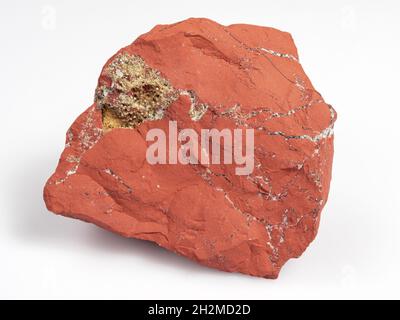Jastic is red on a white background. Semi-precious ornamental stone. Stock Photo