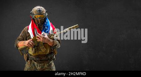An American infantry soldier stands against the background of a ...