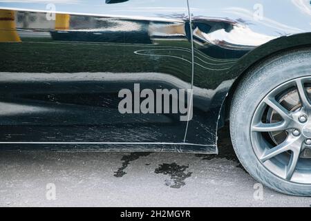 close-up mud splashes on black car in natural lighting Stock Photo