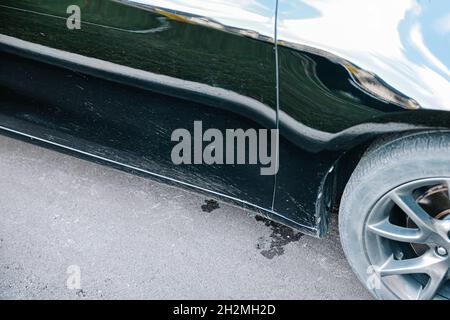 close-up mud splashes on black car in natural lighting Stock Photo