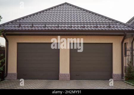 Private new garage with rolling gates for two cars Stock Photo
