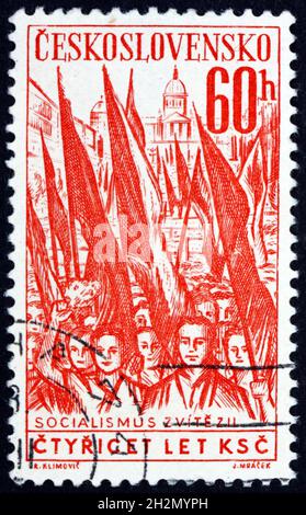 CZECHOSLOVAKIA - CIRCA 1961: a stamp printed in Czechoslovakia shows Crowd with Red Flags, circa 1961 Stock Photo