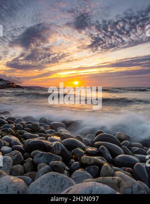 Cloudy sunset on Westward Ho! beach - Westward Ho!, Devon, UK Stock Photo