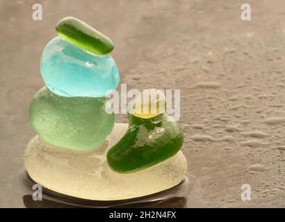 Glass and clay beads of different shapes and colors displayed in