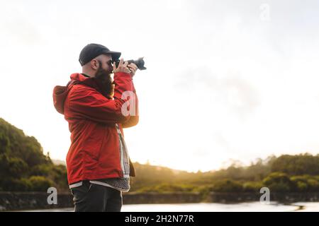 Male tourist photographing through camera Stock Photo
